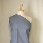 100% cotton Western chambray fabric in navy draped on mannequin